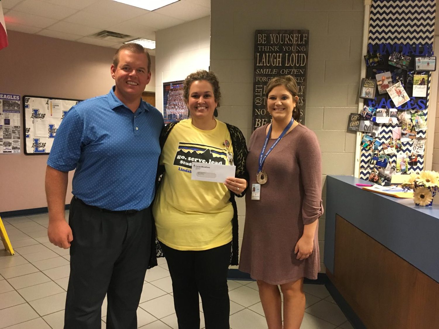 Student Council co-sponsor Dare Kirklin receives a grant of $1,500. Student Council earned the grant after hosting three blood drives last school year.