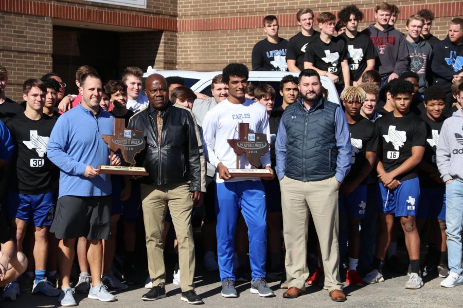 The team poses in front of the Ford. "The real awards are the times and memories I have with my teammates," Jenkins said. "It’s an honor to got this award and I’m glad I got it, but I won’t let it change me as a person."
