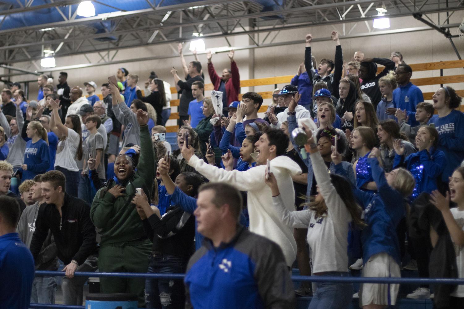 The student section roars after lindale scores a point during the basketball game. I love the energy that I get to show with my friends for the basketball team. Junior Jared Maeker said.