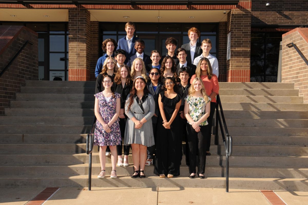 Speech and debate poses for a group photo. Image provided by teacher Kristin Schlessman.