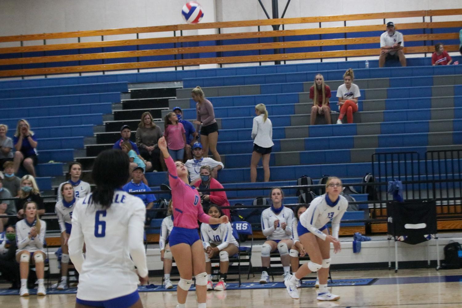 Senior Marleigh Thurman hits the volleyball over the net. The Lady Eagles 6-0 undefeated in district.