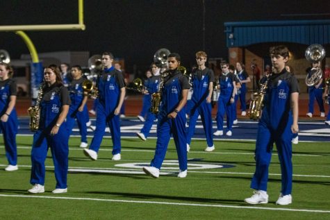 The band begins to march their socially distanced drill. The band was spaced out twice as far as the normally are.