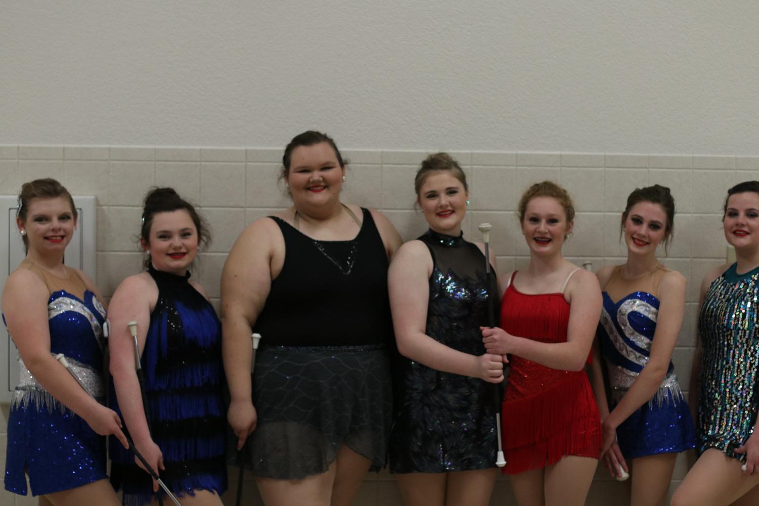 The twirlers pose after competing in their solos. All the twirlers advanced to state in their ensembles and four advanced in their solos.