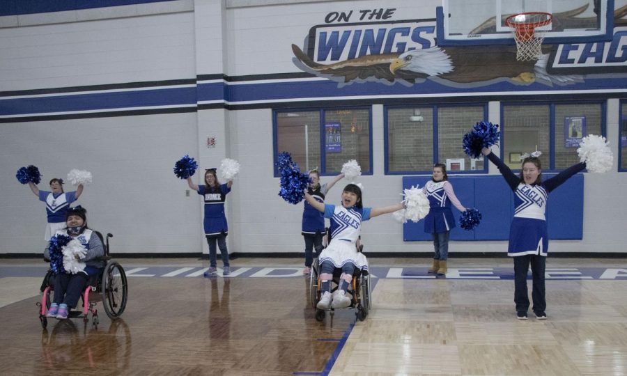 The Pathfinders practice their cheer during their P.E. class. “I just want everybody to know not to underestimate our students with special needs,” adaptive P.E. teacher Christy Bateman said. “They have such joy in life and they really set their bars high. I want to be the best that I can be for them and just offer opportunities to have fun and be joyous and to just love life.”