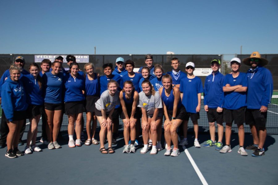 Tennis team poses for a picture after the regional quarter finals. 