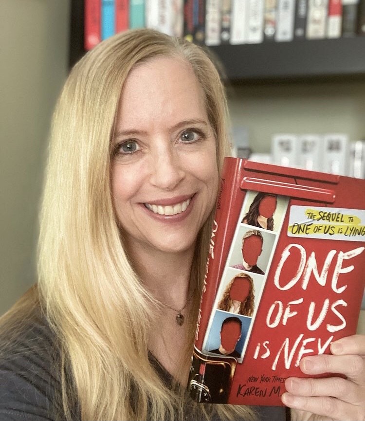 Author Karen M. McManus poses with her novel One of Us is Next to celebrate its advancement in the Goodreads Choice Awards. The book had not been out for a year and made it to the finals for the award in fiction.