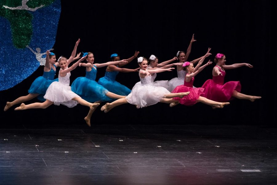The 2019 KDF junior team performs for their families. Dancing is so special because you can really express yourself in any way you want, freshman Charlotte McConathy said. There are so many options so anyone and everyone can find a way to express themselves and be happy.