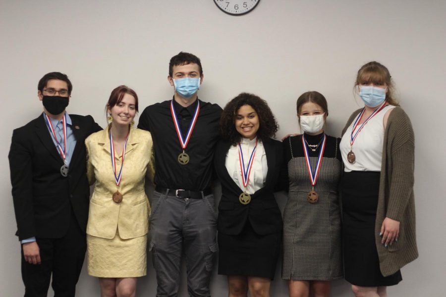 The speech team poses after they competed. They will compete at state Tuesday and Wednesday.