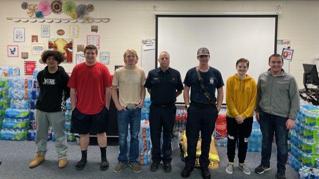 5th Period Law II students pose with Lindale Fire Chief Joe Yeakley and volunteer John Nilson during their visit to the high school. 