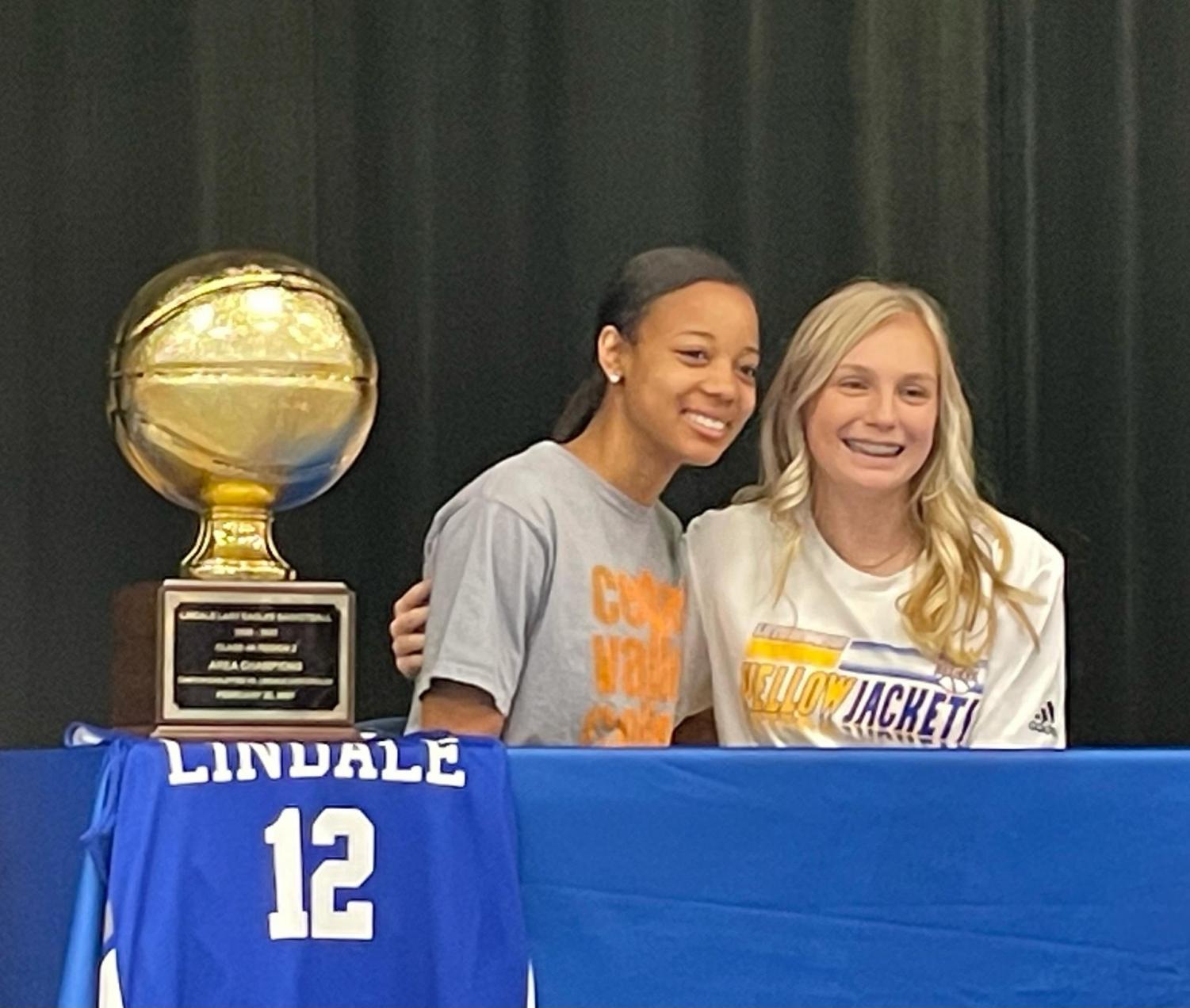 Seniors Lily Chamberlain and Kalaya Pierce signed to play sports at the college level on April 22. Pierce signed to play volleyball at Cedar Valley College and Chamberlain will play basketball at LeTourneau University.
“I am very excited for both of these young ladies to have the opportunity to go compete at the next level,” basketball coach Daniel Devisscher said. “Going to college to play sports is not easy as very few are chosen, they understand what it takes and are willing to put the work in to be great.”
The two girls played together on the basketball team reaching a regional quarterfinals title in the playoffs. Chamberlain, a shooting guard, will continue that legacy of basketball excellence in college at LeTourneau in Longview, Texas. 
“I chose LeTourneau because of the environment and how close it was to home,” Chamberlain said. “I just really fell in love with the coaches and my teammates in Longview.”
Pierce played for the girls varsity volleyball team last fall where the team went undefeated throughout district, competing in the playoffs. Pierce is continuing her education and volleyball career at Cedar Valley College in Lancaster, Texas.
“I chose Cedar Valley because I love the team and how truly accepting they were,” Pierce said. “They really just brought me in and made me feel like I was just at home.”
