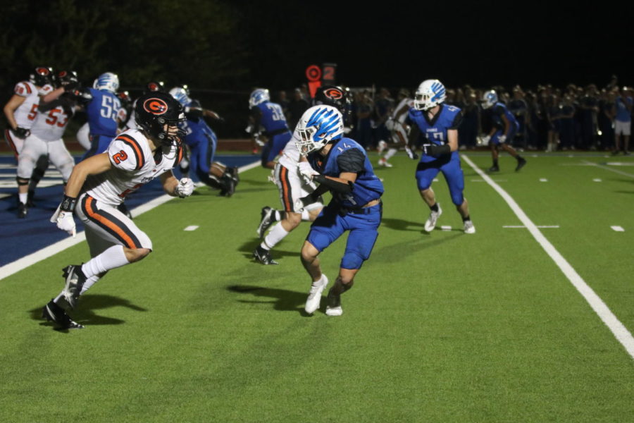 Junior Michael Shannon rushes to block an opponent near the endzone.