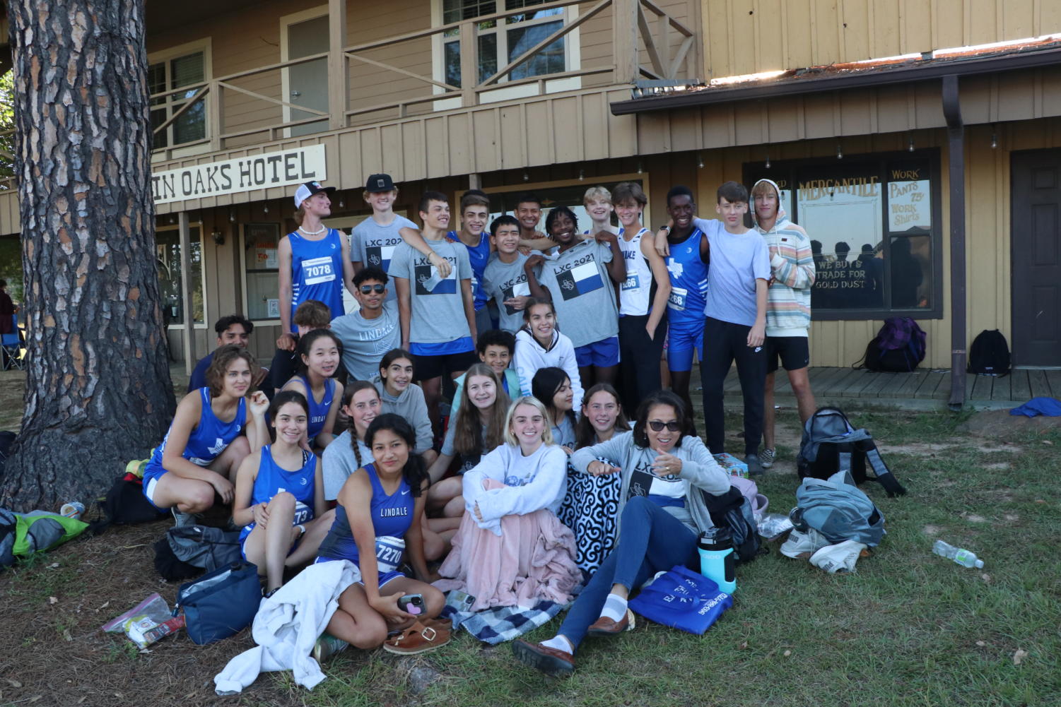 The cross country team poses for a photo after a meet. Both the boys and girls teams are featured here.