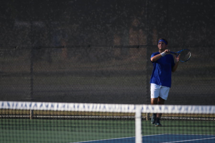 Senior Aaron Roden prepares to hit the ball at the district tournament. Roden plays on the varsity team. 