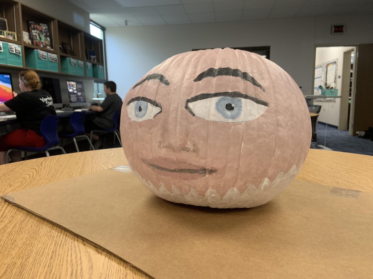 Yearbook students create their pumpkin for the contest.