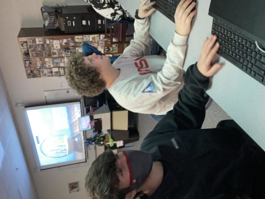 Seniors Chase Klein and Peyton Lebaron design the basketball program. I took graphics design with Mrs. Kelly last year, which taught me a lot in photoshop, Lebaron said. It’s really cool to get to experience designing something for the school.