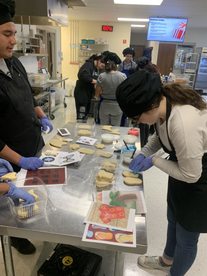 Culinary student work on ornaments.