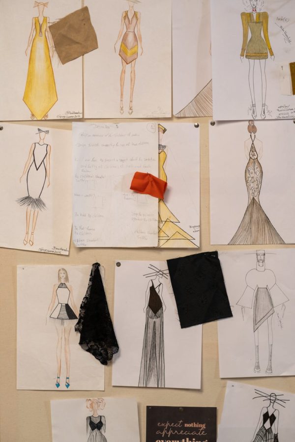 Designer shows dress sketches.