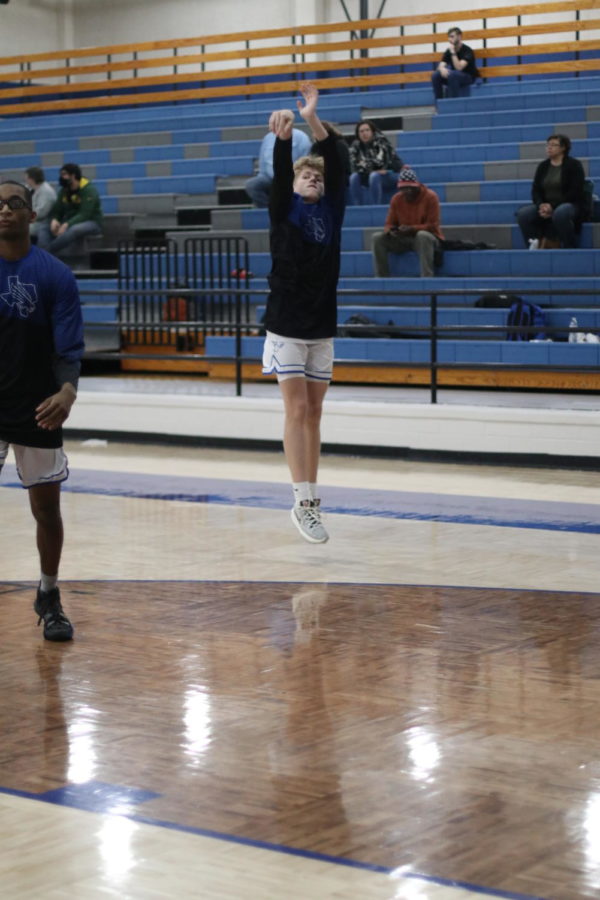 Sophomore Cole Collinsworth warms up before the game.