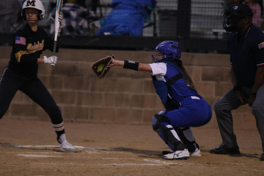 Senior Adriana Rodriguez catches the ball as it heads towards home plate.