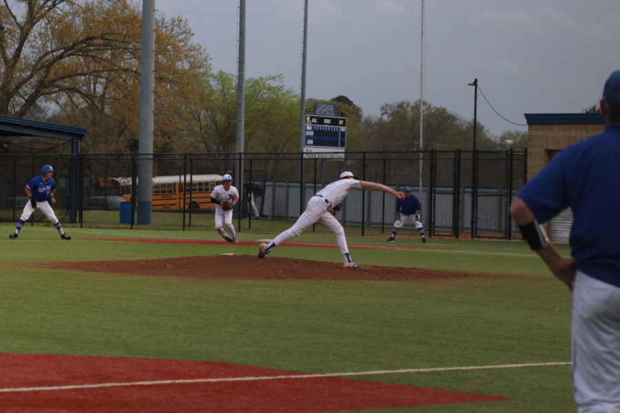 Senior Sam Peterson pitches during their game against Spring Hill.