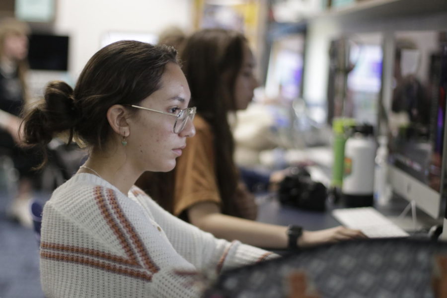 The yearbook staff works on the yearbook after school.