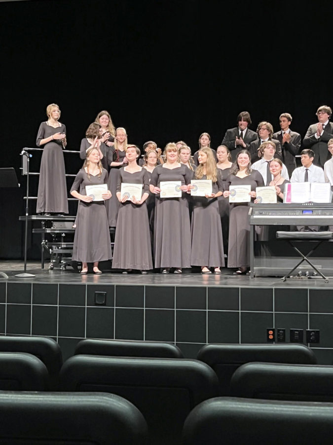 Choir+students+receive+their+award+at+the+Spring+Concert.+