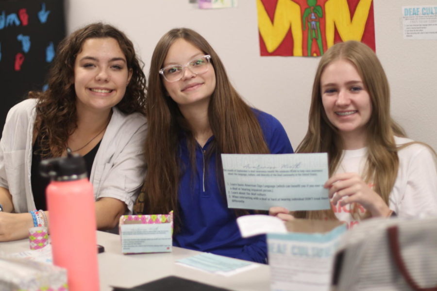 Sophomores Irelynn McWithey, Alyssa Estes, and Josie Roach working on their project. “Three ways to celebrate deaf culture awareness month is to learn basic sign language, learn about deaf culture, not to treat deaf people differently.” Josie Roach said.