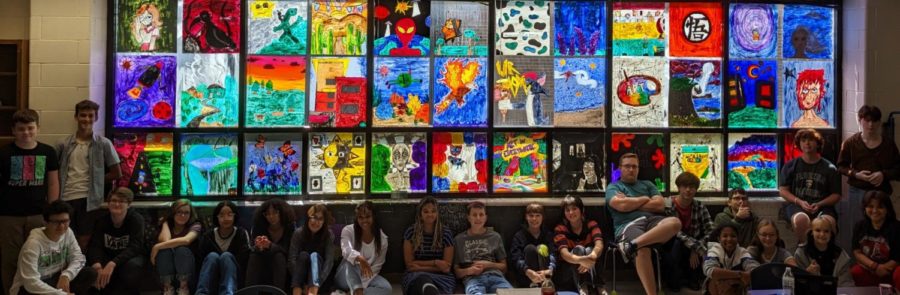 Sixth+period+art+students+pose+in+front+of+their+art+murals.