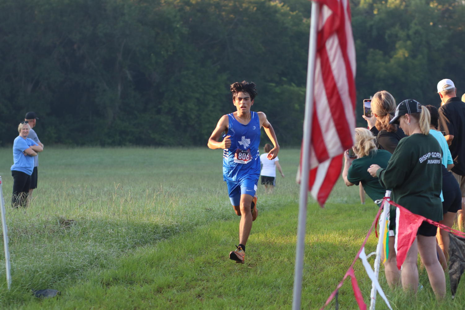 The boys varsity cross country team runs the two mile race.