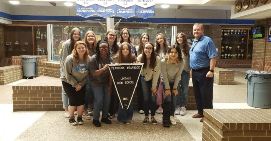 Yearbook staff with their Balfour banner. This is Lindales third time being included since 2018.