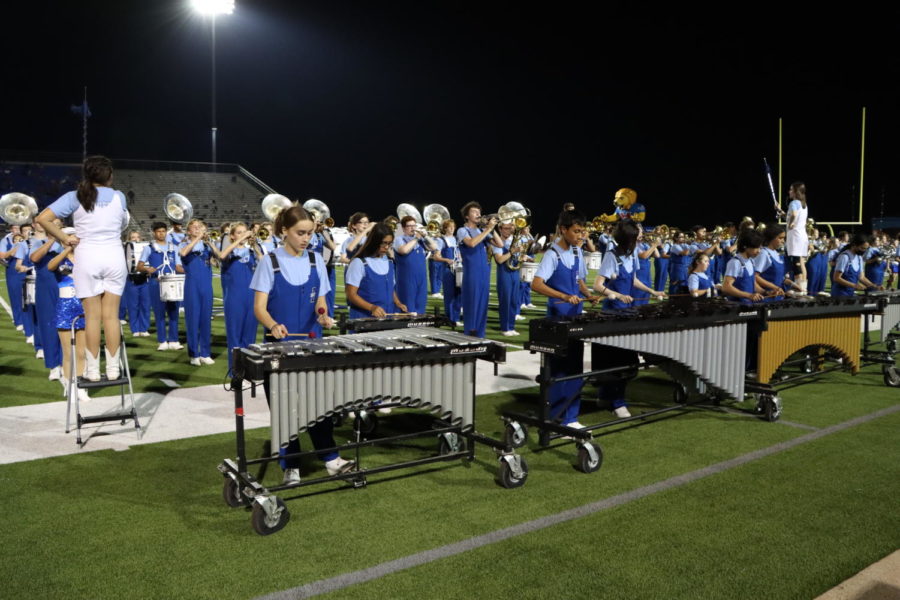 Band+performs+UIL+drill+during+halftime.+Marching+at+football+games+gives+us+many+chances+for+full+performance+runs%2C+sophomore+Paula+Arantes+said.+It+gives+us+a+sense+of+how+the+performance+will+go+at+UIL.