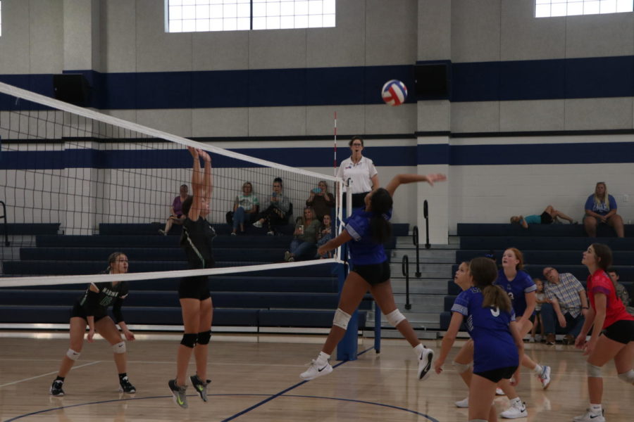 Freshman Kenlie Collins spikes the ball at a ninth grade game.