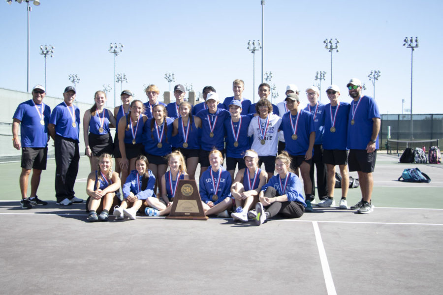 The team poses with their trophy after competing at the state competition. This team will play until they have nothing left but what they have given, junior Zoe Bozick said.