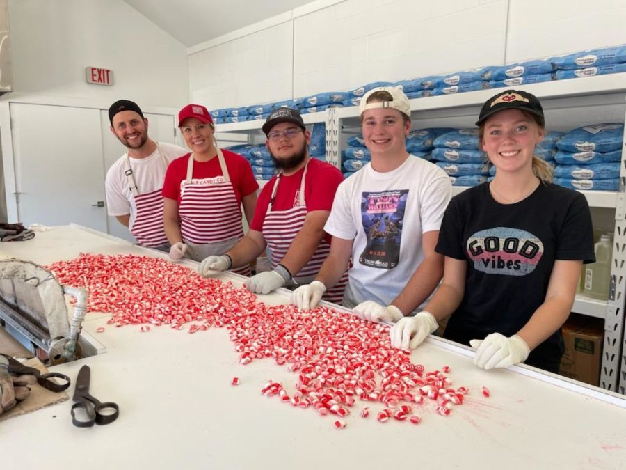 Students in the Internship in Business Management class pose with the candy they have made. The Lindale Candy company is one of the many businesses the class has partnered with this year.