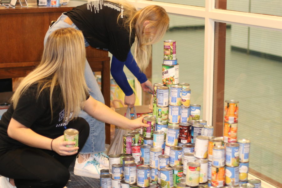 StuCo members Burkelyn Allen and Sadie Akin counts the cans. Its really nice to work together and to do something good for the community, StuCo president Hannah Evans said.