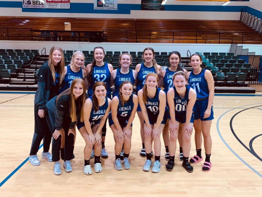 The Varsity basketball girls pose after a game in Jacksonville. I am excited for this season, junior Lydia Payne We have put in a lot of our efforts and Im excited to put it into play.