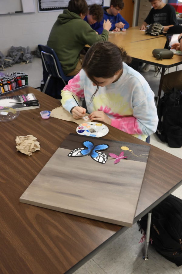 Art students paint projects for the upcoming big art day.