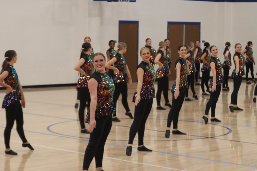 The drill team performs their competition dance at a show off.