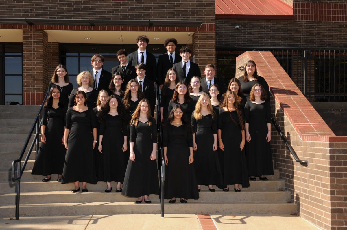 Choir poses for a group photo. Photo provided by teacher Kristin Schlessman.