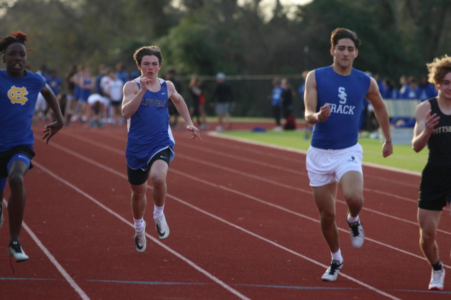 Freshman Creed Rand runs a sprint in the track meet.