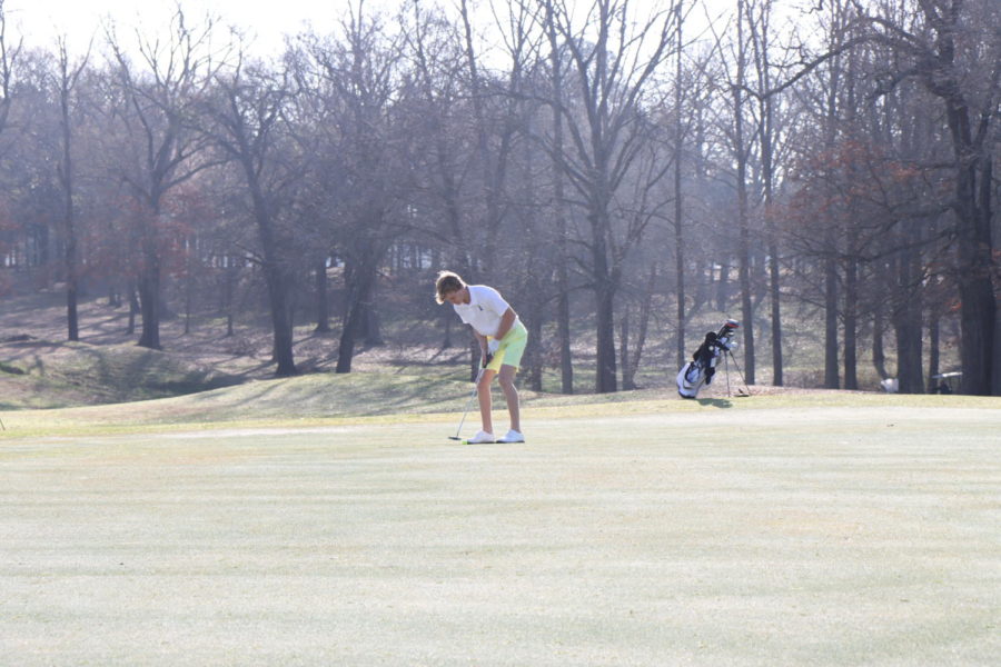 Junior Ryan French putts in a golf tournament at Garden Valley.