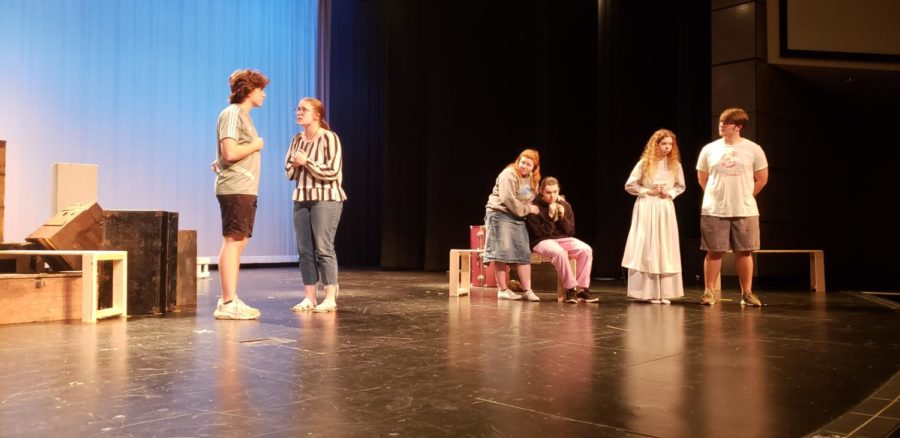 Senior+Olivia+Harwell+and+her+cast+mates+practice+on+the+stage.+%E2%80%9CI+enjoy+theater+for+so+many+things%2C+Harwell+said.+I+love+the+camaraderie+of+the+cast+and+the+family.+We+have+the+ability+to+love+each+other.%0A