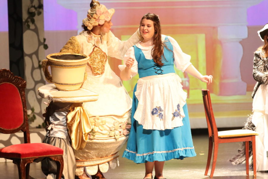 Harwell and junior Ashlynn Blankenship perform as their characters in Beauty and the Beast. “It really showed me that she believed in my abilities,” Harwell said. “[Mrs. Potts] showed me that I could do more than I thought I could.”
