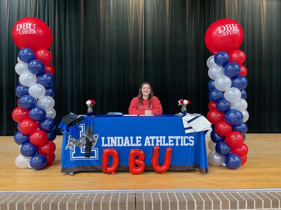 Bailee Breaux poses at the signing tables. She will be joining the DBU cheer and stunt team.