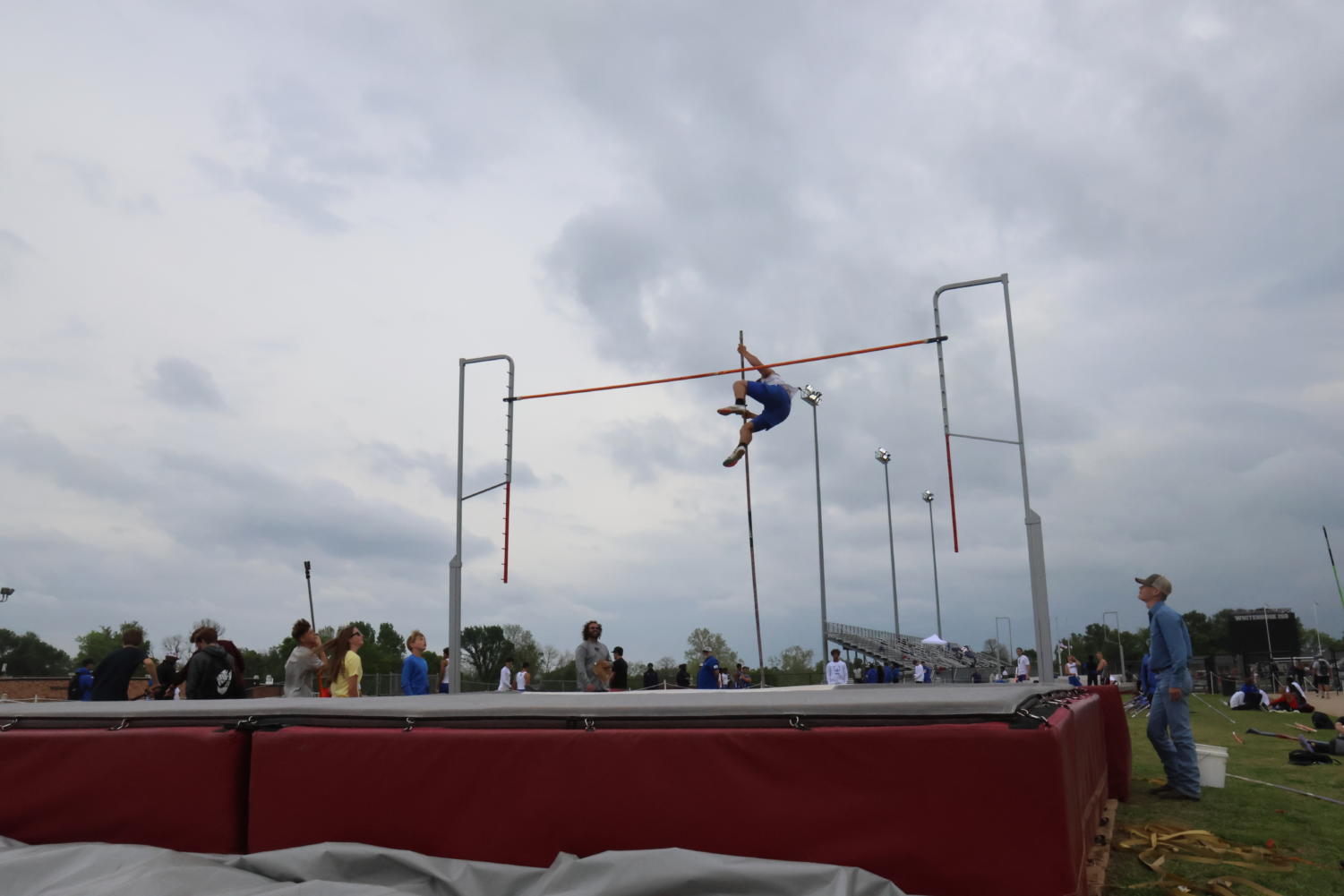 Junior Justin Seekford pole vaults at the varsity track meet on March 30.
