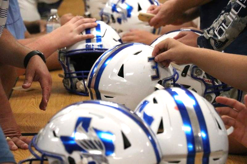 Football Players Participate in Decals With Dads Event