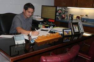 Kyle Wright working at his desk.
