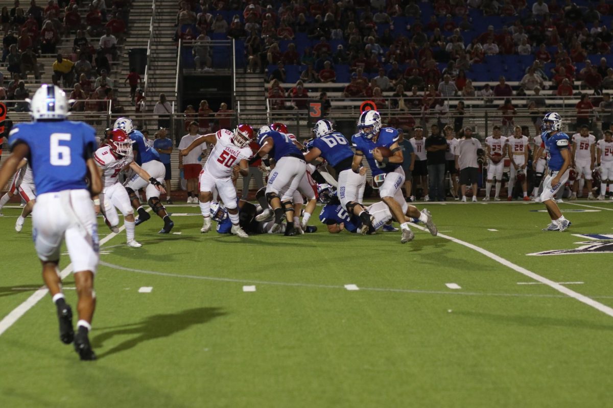 Senior Wyatt Parker runs with the ball. This game was against Van.