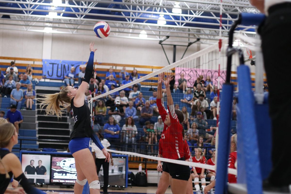 Senior Middle Blocker Kayli Vickery hits the ball over the net. They played against Van September 9.