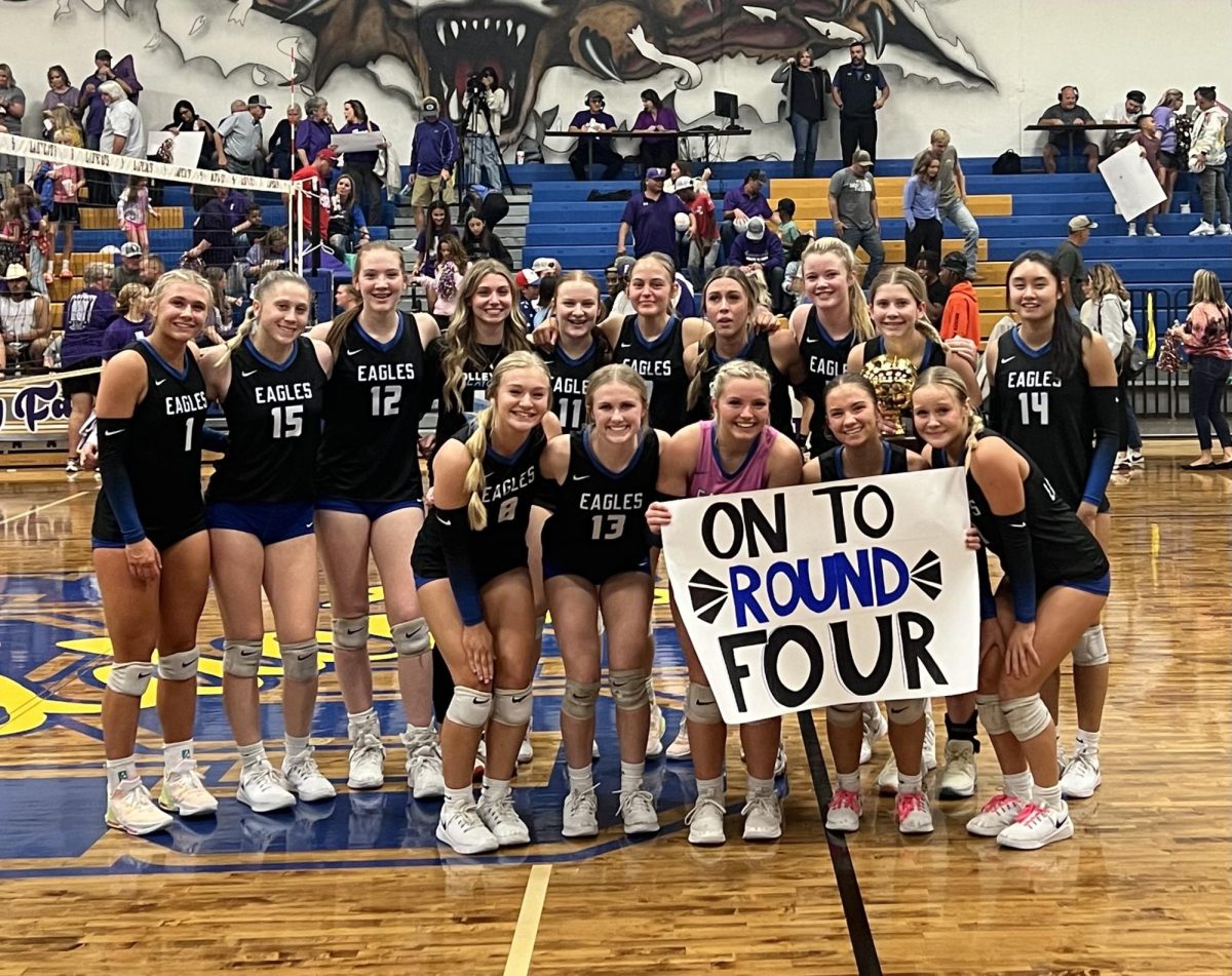 Lady Eagles Volleyball team pose for a photo post quarter-finals win. This win took them to the finals. Photo provided by head volleyball coach Jessica Dimsdle.